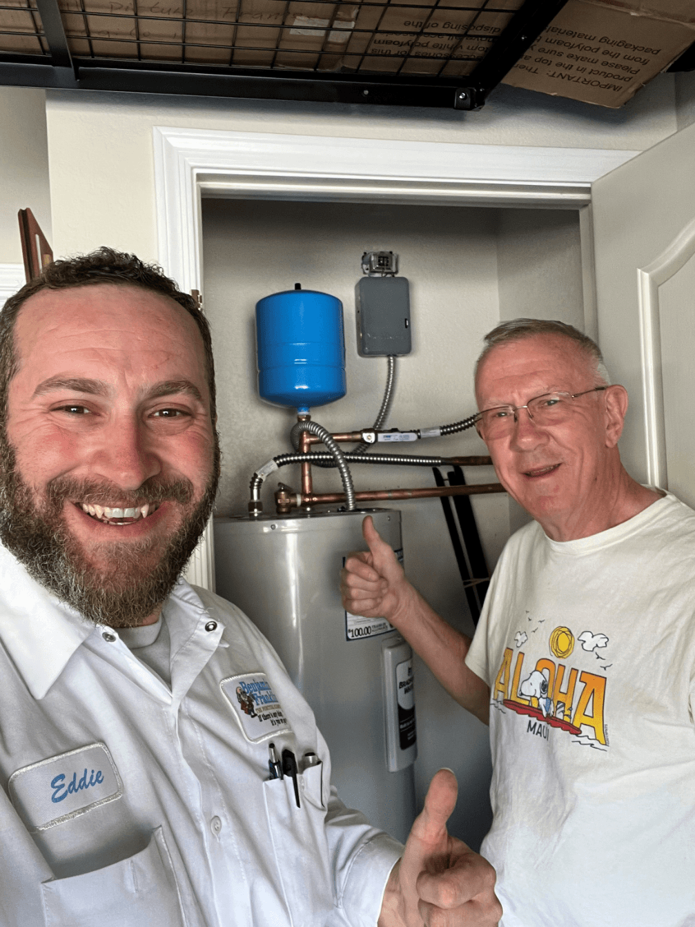 Benjamin Franklin Plumbing technician Eddie with a happy Phoenix customer